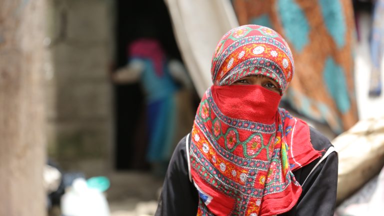 Yemeni lady gazes at the camera.